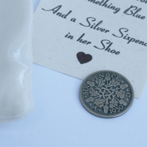 zilveren sixpence voor in de schoen van de bruid